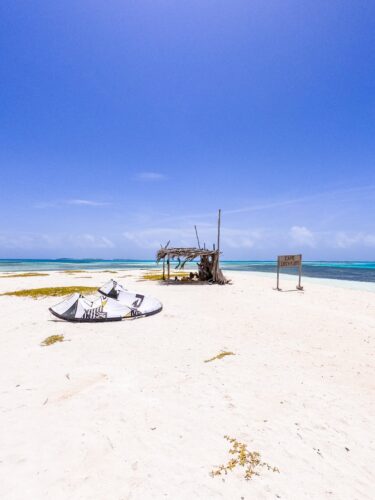 Breathtaking tropical beach in Venezuela with white sand and clear blue water. Relaxed, remote island vibes.