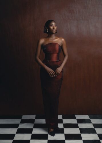 A stunning portrait of a woman in traditional Nigerian fashion, showcasing elegance and cultural style.